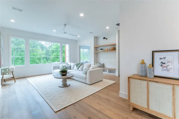 a living room with furniture and a large window