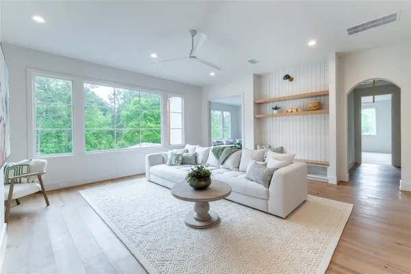 a living room with furniture and a large window