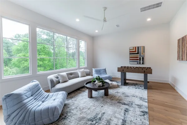 a living room with furniture and a large window
