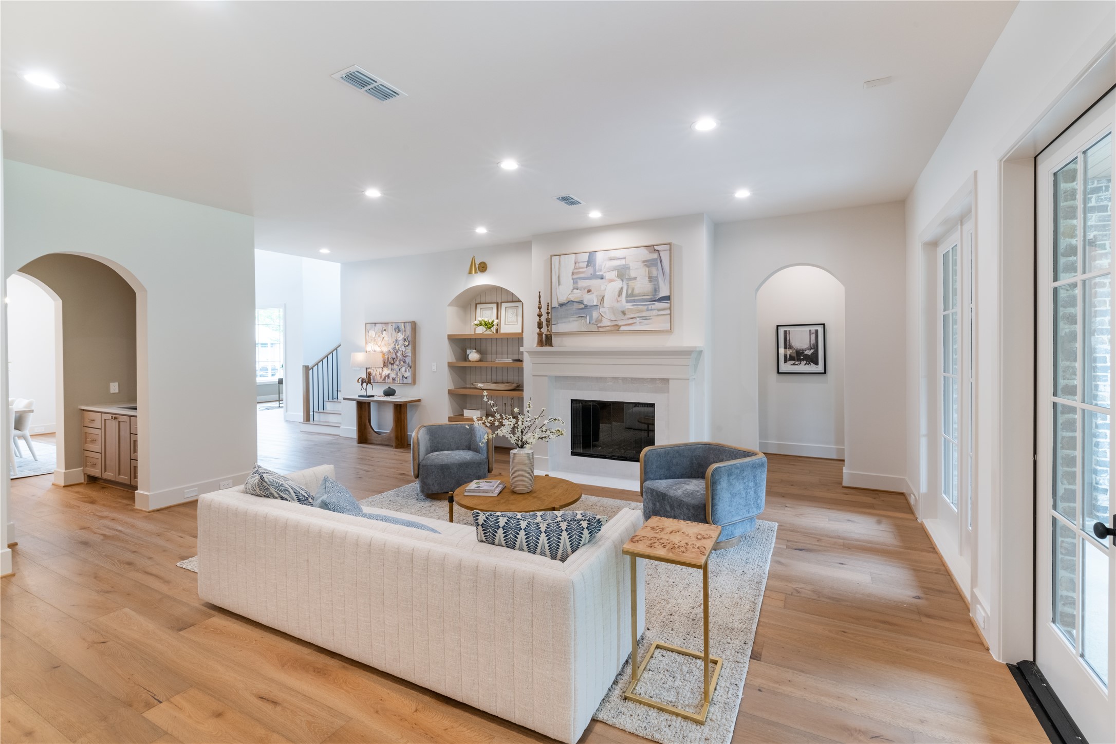 24710 Lake Kent Lane Spring, TX 77389 - Photo 5 of 33 a living room with fireplace furniture and a wooden floor