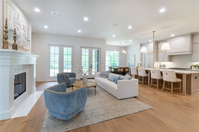 a living room with fireplace furniture and a fireplace