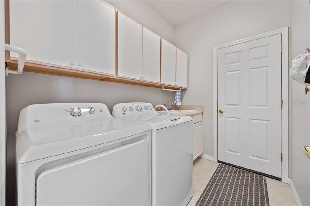 20907 Tangor Road Land O Lakes, FL 34637 - Photo 21 of 49 a utility room with dryer and washer