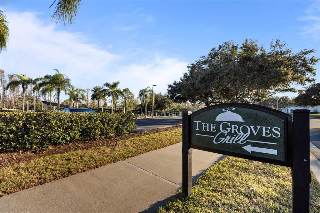 20907 Tangor Road Land O Lakes, FL 34637 - Photo 34 of 49 a view of a street with sign board