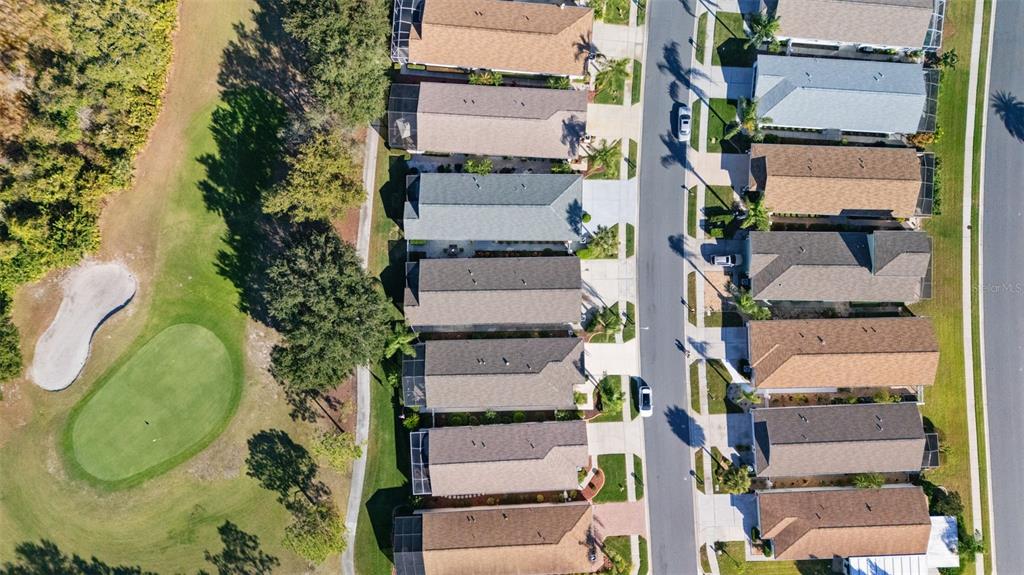 20907 Tangor Road Land O Lakes, FL 34637 - Photo 43 of 49 an aerial view of a residential apartment building with a yard and parking space