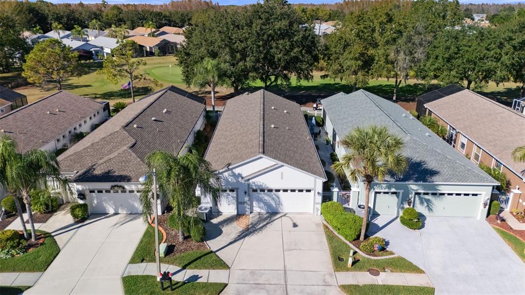 20907 Tangor Road Land O Lakes, FL 34637 - Photo 44 of 49 an aerial view of house with yard swimming pool and outdoor seating