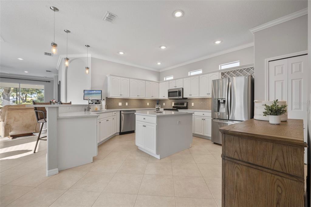 20907 Tangor Road Land O Lakes, FL 34637 - Photo 8 of 49 a kitchen with white cabinets and white appliances