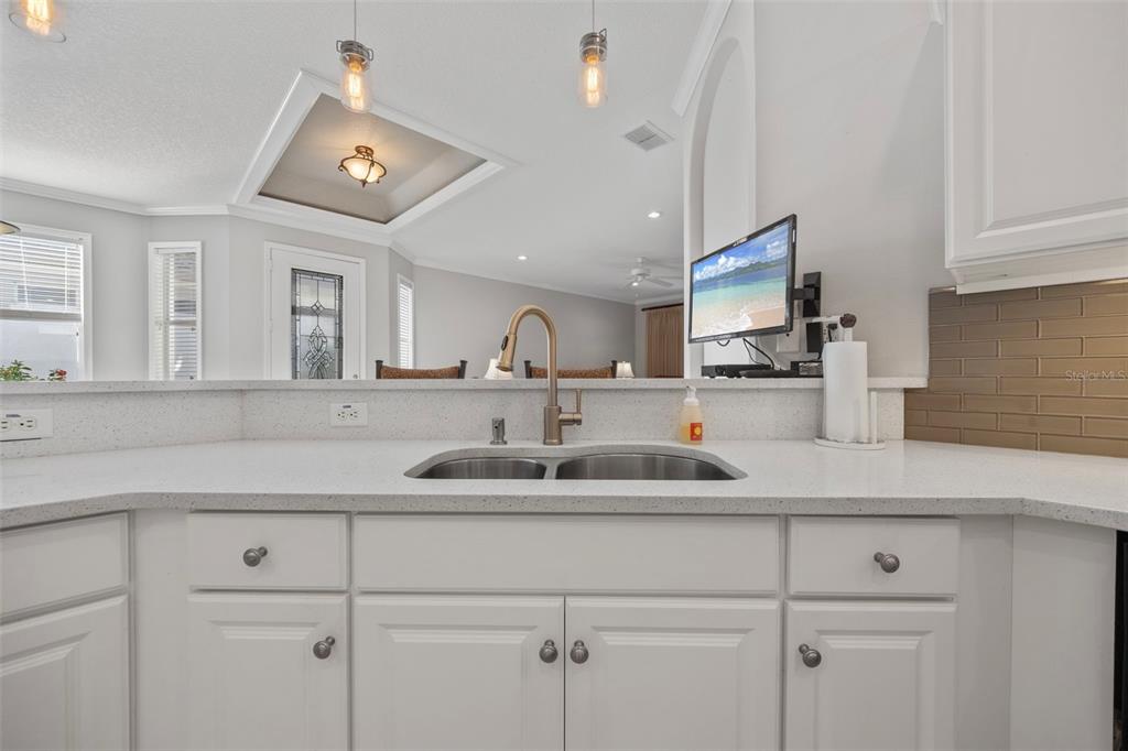 20907 Tangor Road Land O Lakes, FL 34637 - Photo 10 of 49 a kitchen with cabinets stainless steel appliances a sink and a window
