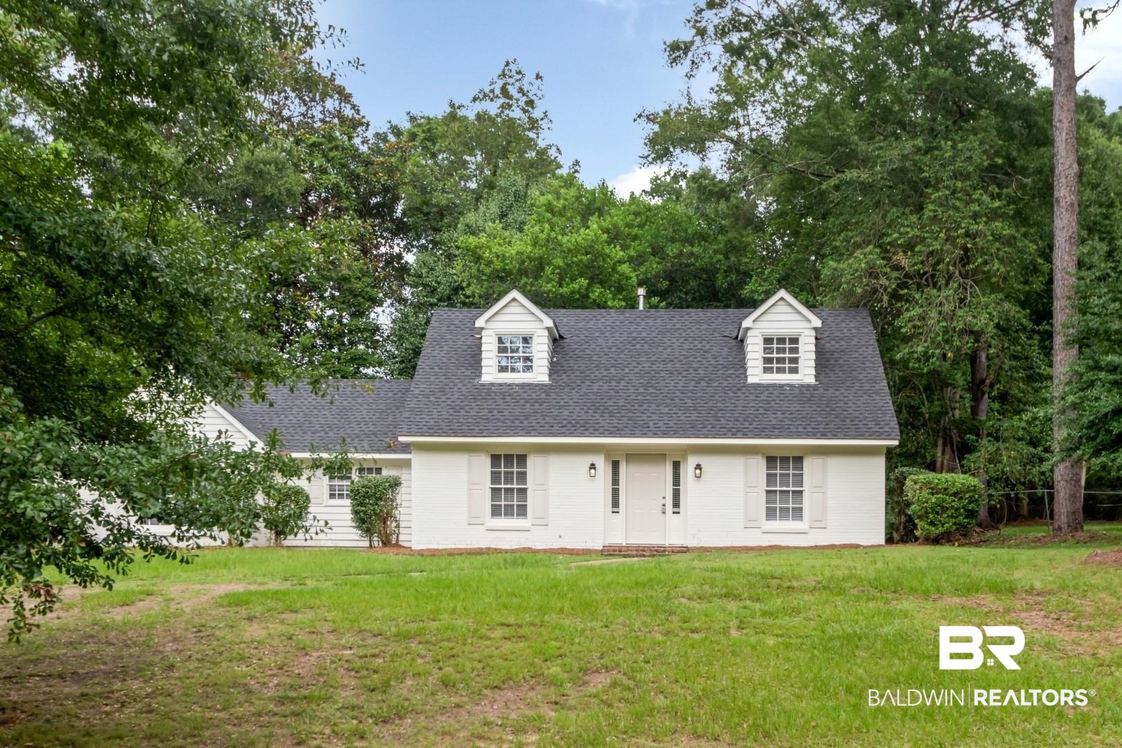 810 Nassau Drive Mobile, AL 36608 - Photo 24 of 31 New england style home with a front yard and a shingled roof