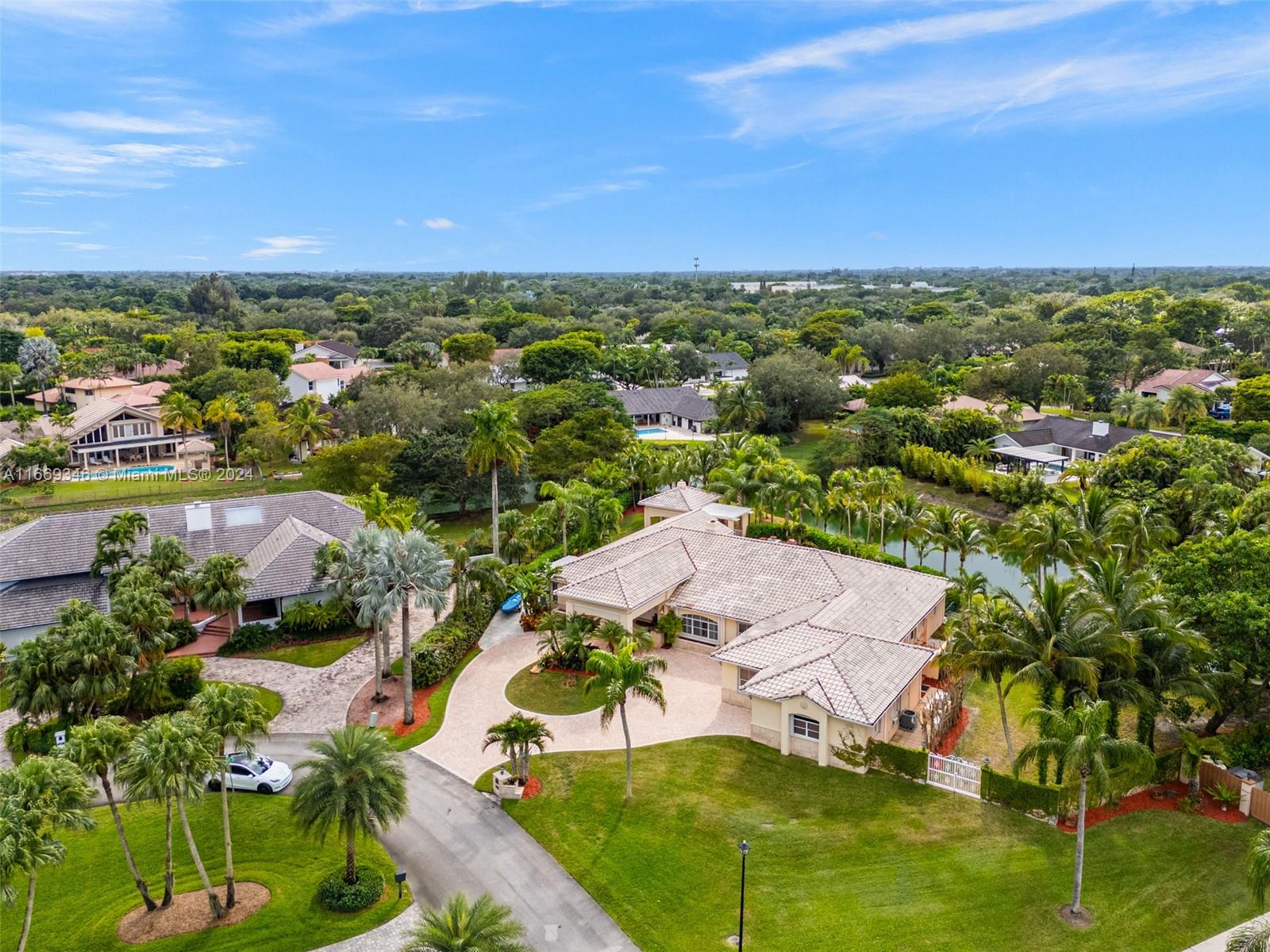 10120 Southwest 93rd Avenue Miami, FL 33176 - Photo 54 of 61 an aerial view of residential houses with outdoor space and trees