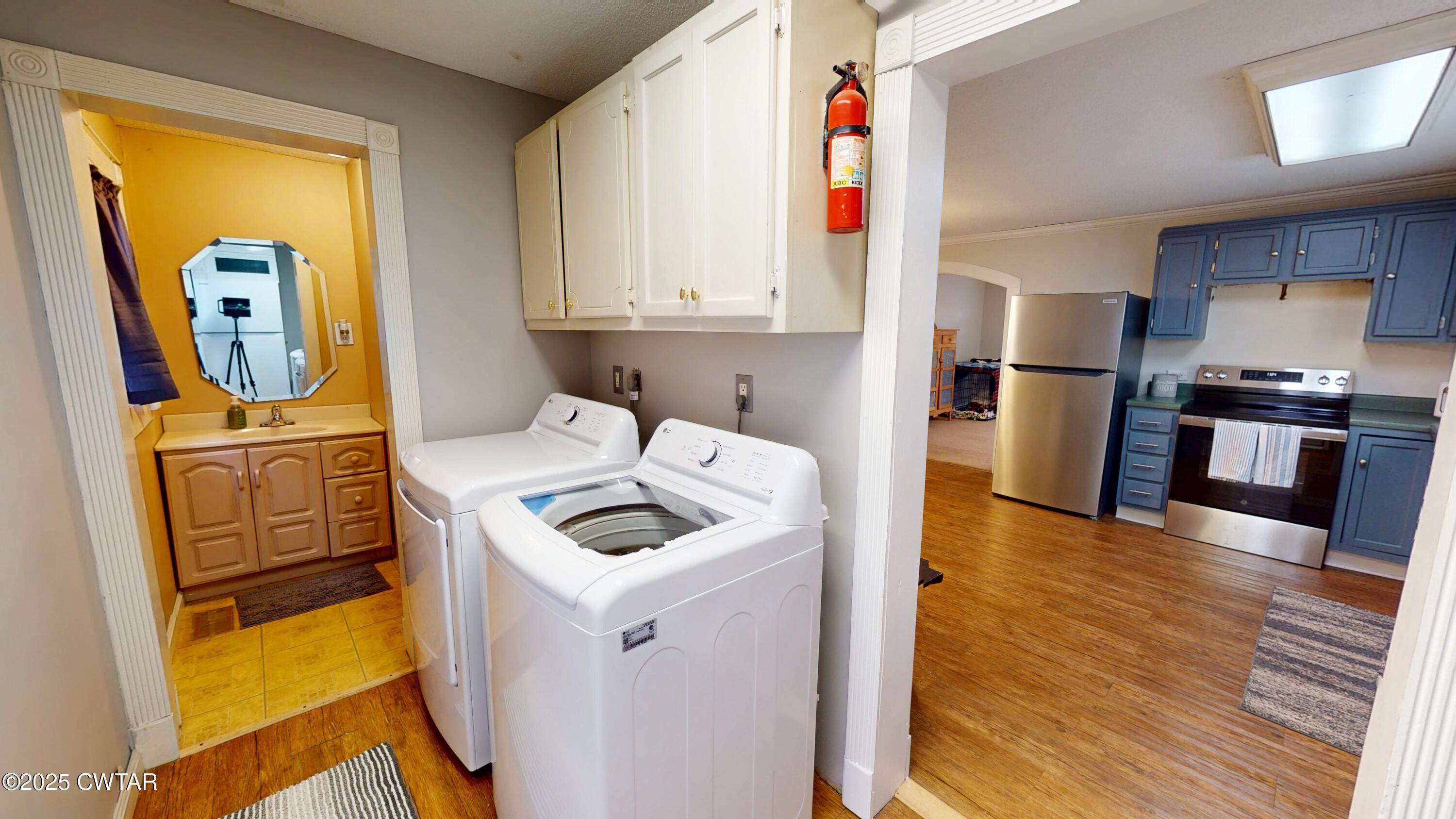 429 Church Street Ridgely, TN 38080 - Photo 15 of 35 a kitchen with stainless steel appliances granite countertop a sink a stove and a refrigerator