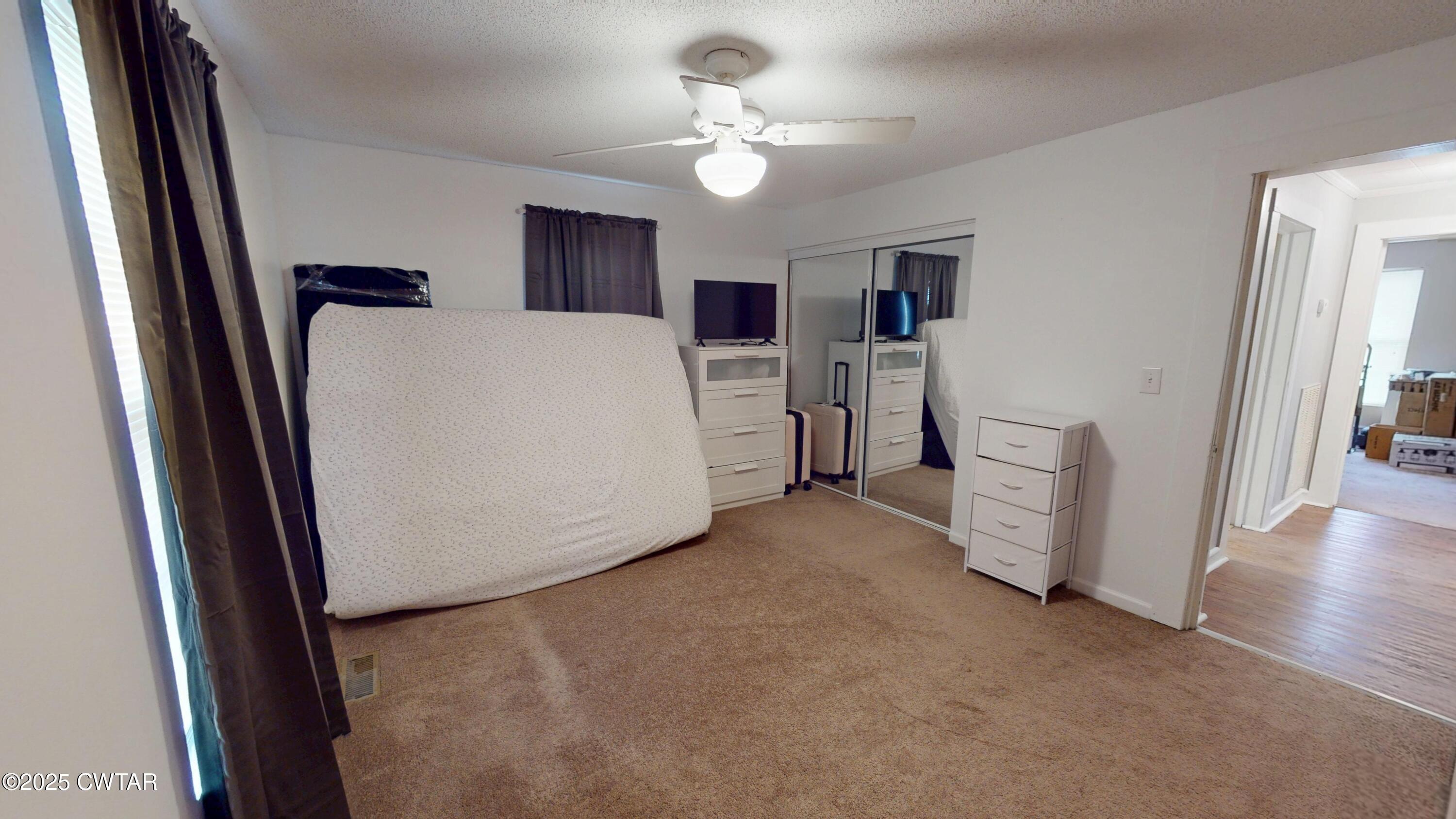 429 Church Street Ridgely, TN 38080 - Photo 20 of 35 a view of a room with closet and windows