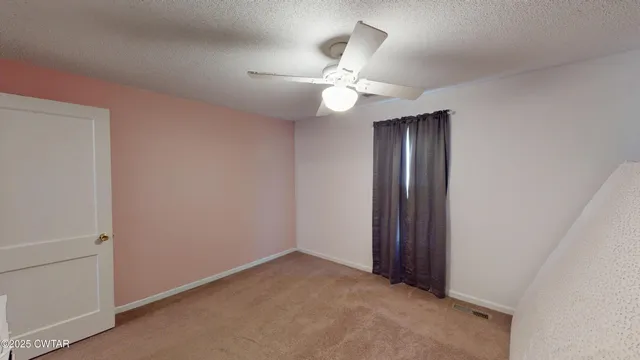 a living room filled with furniture and a flat screen tv