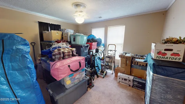 a room with furniture and a flat screen tv