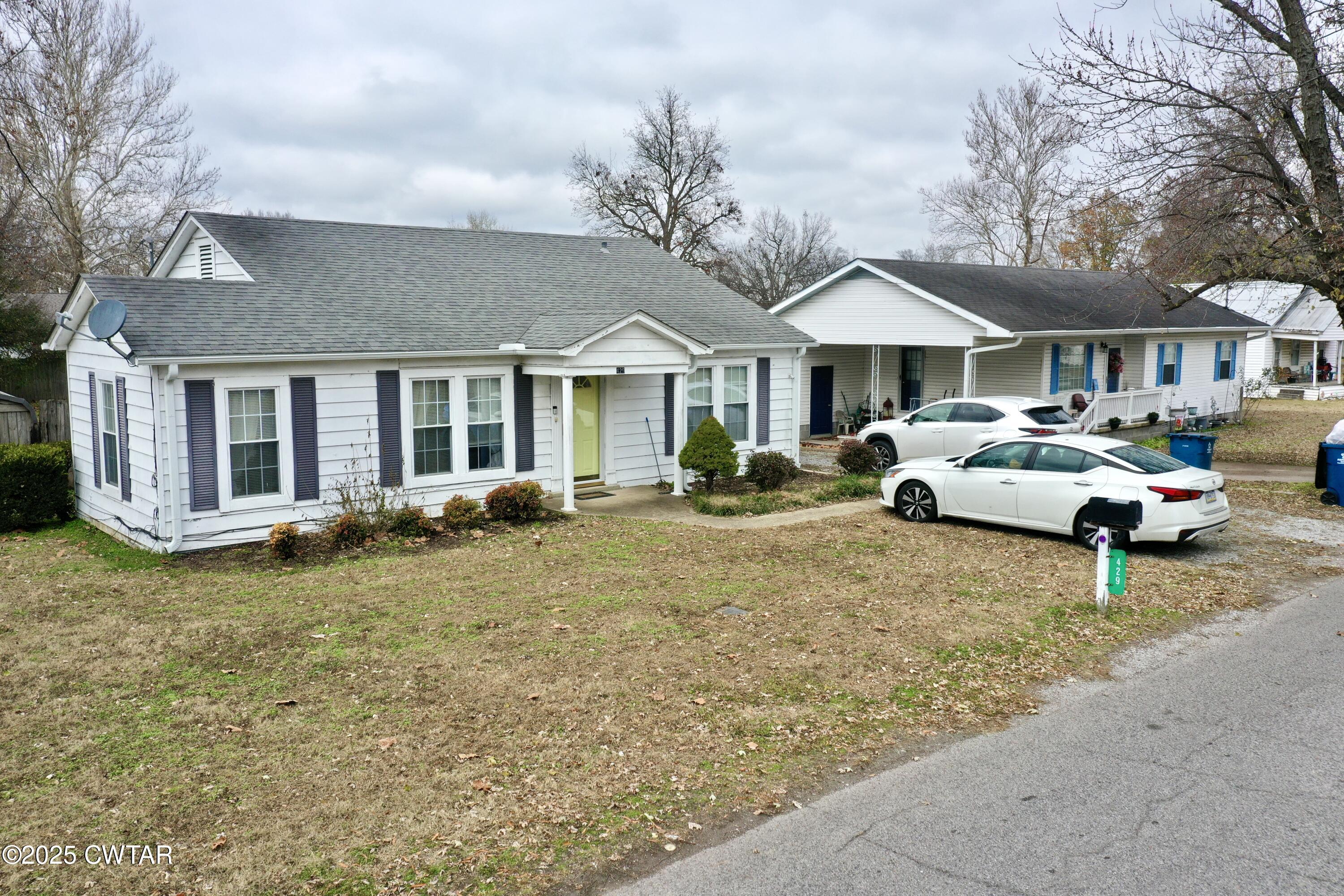 429 Church Street Ridgely, TN 38080 - Photo 28 of 35 a front view of a house with a garden