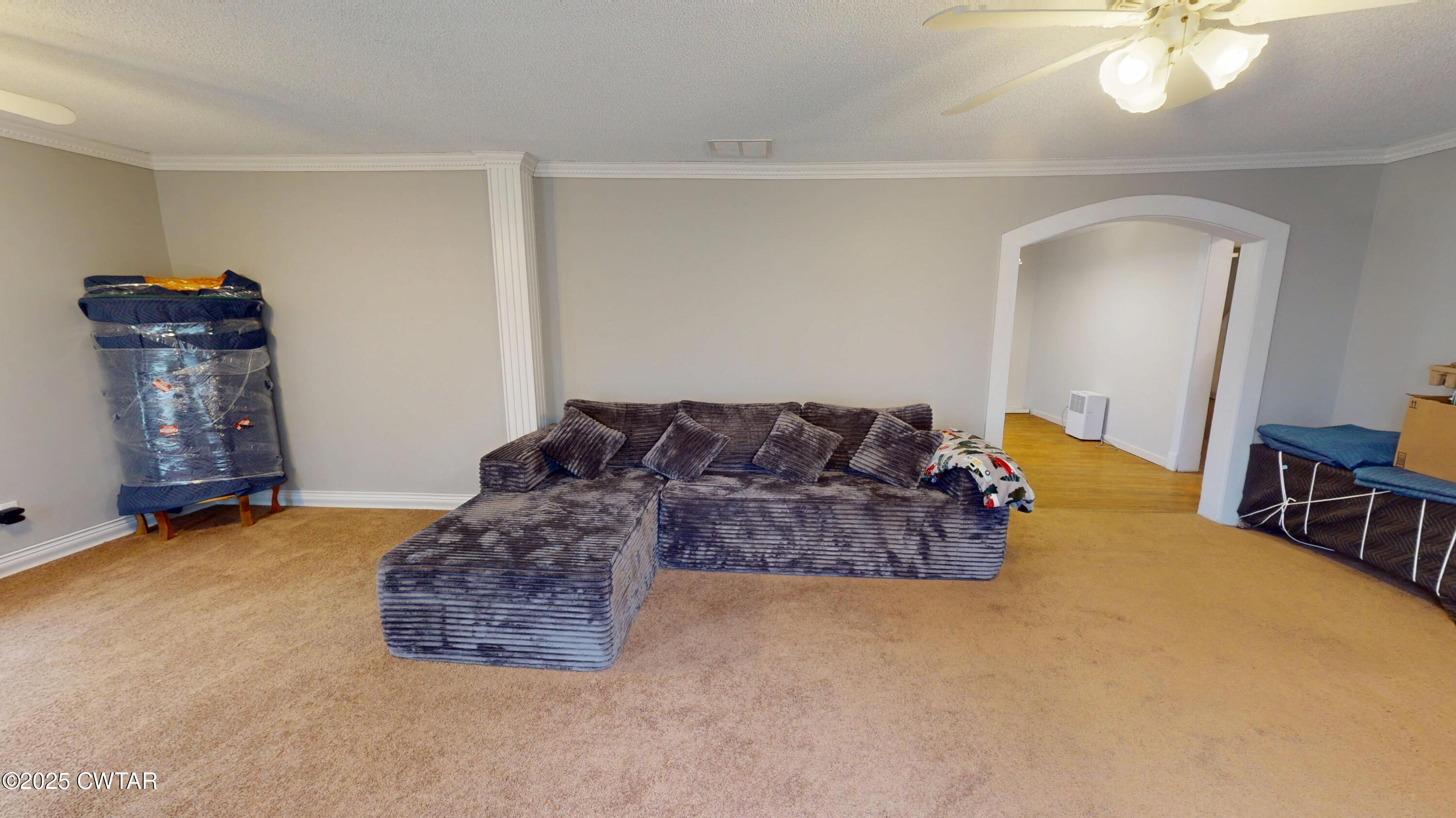 429 Church Street Ridgely, TN 38080 - Photo 3 of 35 a living room with furniture and a chandelier
