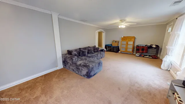 a living room with furniture and a couch