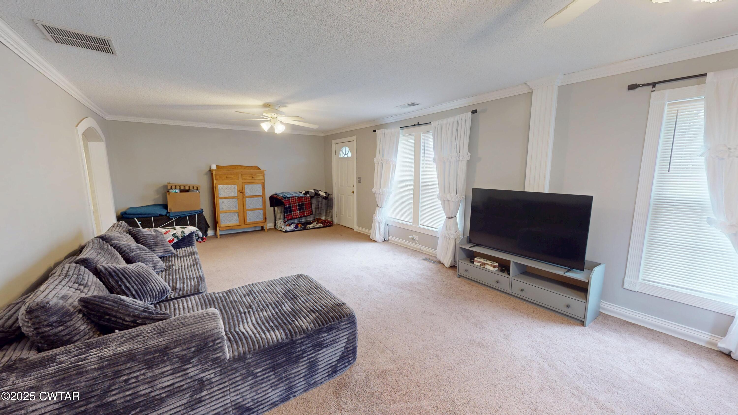 429 Church Street Ridgely, TN 38080 - Photo 5 of 35 a living room with furniture and a flat screen tv