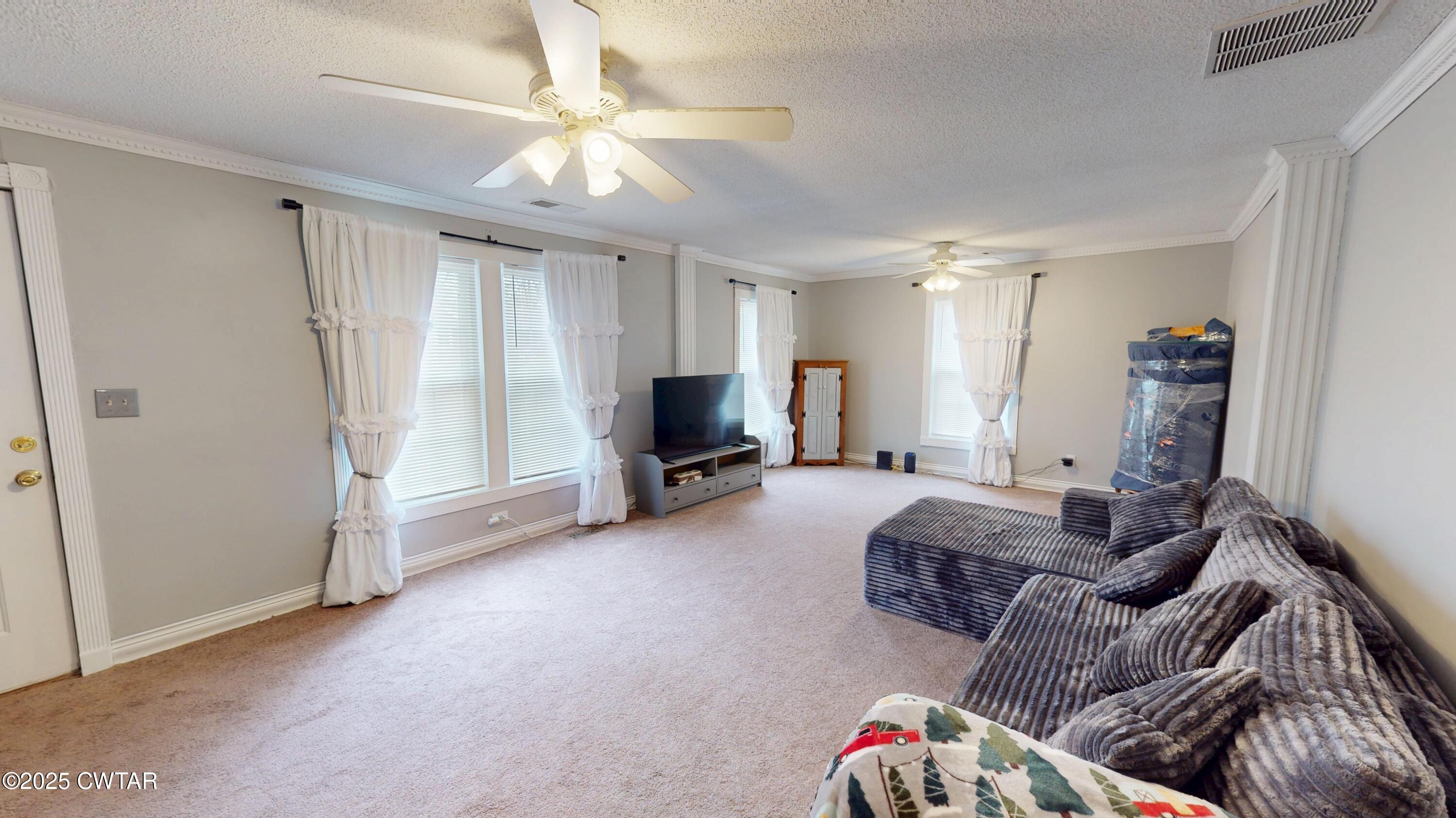 429 Church Street Ridgely, TN 38080 - Photo 6 of 35 a living room with furniture and a flat screen tv