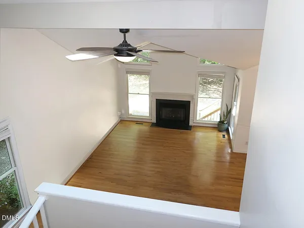 a view of empty room with a fireplace