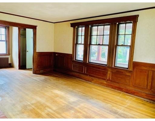 29 Puritan Road Arlington, MA 02476 - Photo 7 of 21 a view of an empty room with wooden floor and windows