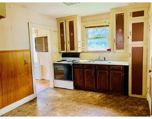29 Puritan Road Arlington, MA 02476 - Photo 10 of 21 a view of kitchen with granite countertop cabinets and window
