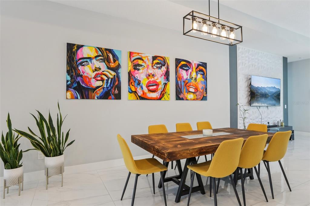 352 Mehlenbacher Road Belleair, FL 33756 - Photo 17 of 88 a view of a dining room with furniture and wooden floor