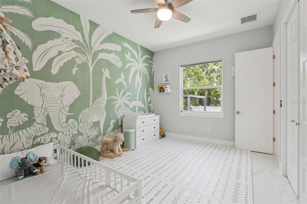 352 Mehlenbacher Road Belleair, FL 33756 - Photo 45 of 88 a bedroom with a bed and a window