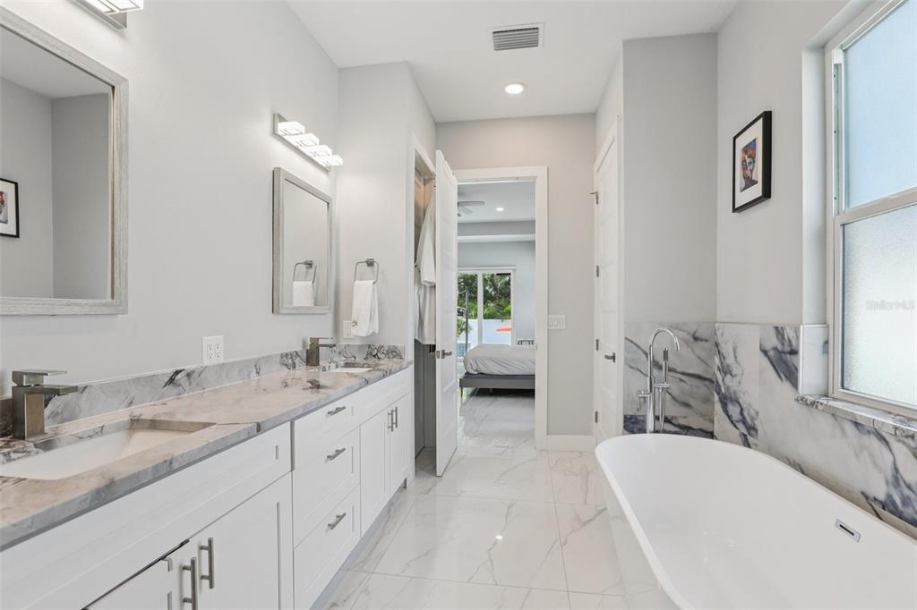 352 Mehlenbacher Road Belleair, FL 33756 - Photo 53 of 88 a spacious bathroom with a tub sink and mirror