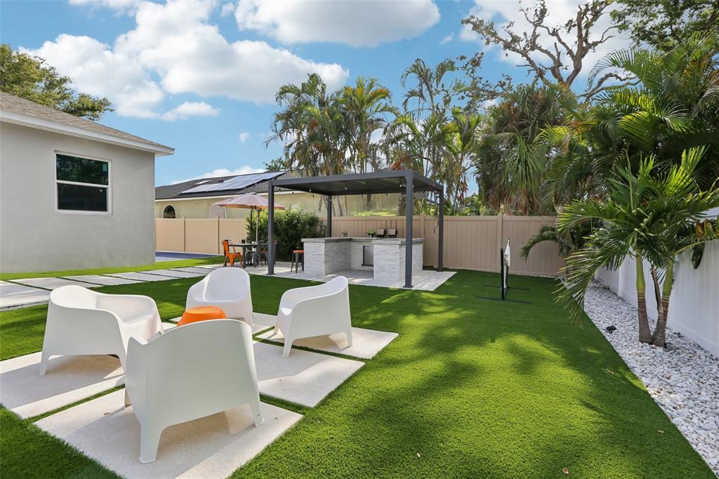 352 Mehlenbacher Road Belleair, FL 33756 - Photo 68 of 88 a view of backyard of house with seating space and trampoline