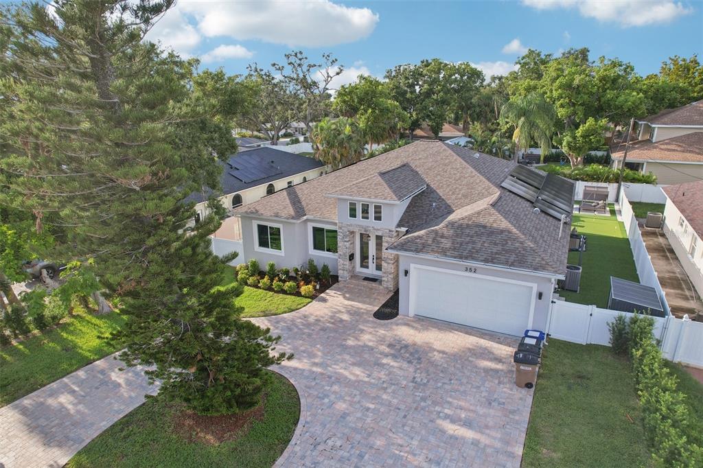 352 Mehlenbacher Road Belleair, FL 33756 - Photo 73 of 88 an aerial view of a house with a yard and trees