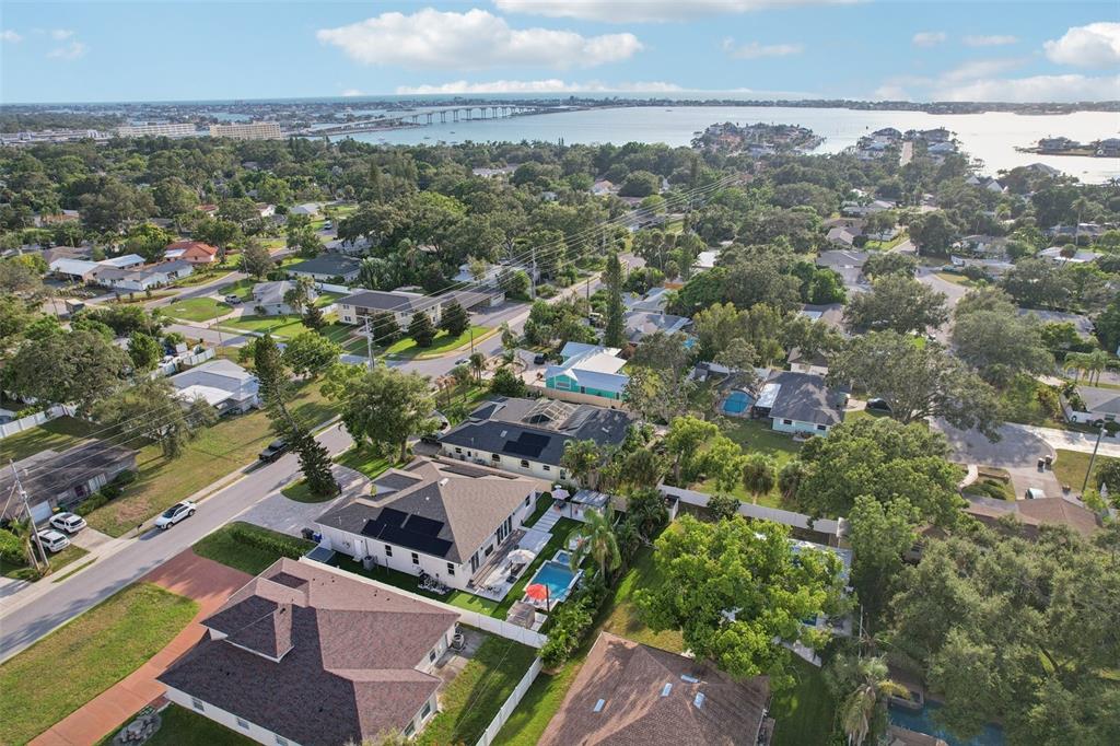 352 Mehlenbacher Road Belleair, FL 33756 - Photo 80 of 88 an aerial view of residential houses with outdoor space and trees