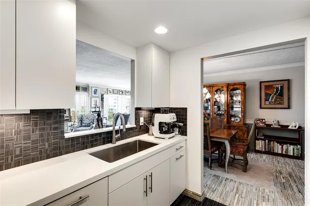a kitchen with a sink cabinets and counter space