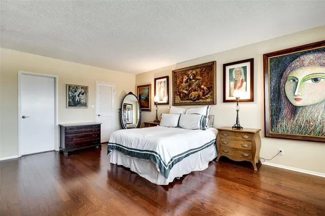 a bedroom with a bed and dresser