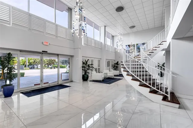 a view of a porch with furniture and a garage