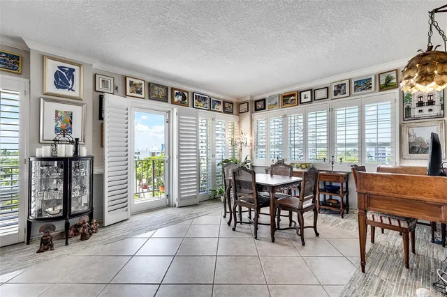 a dining room with furniture and chandelier