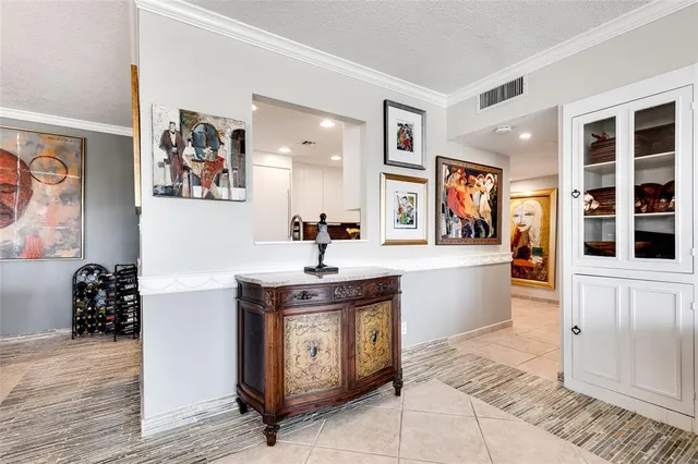 a view of kitchen with stainless steel appliances granite countertop a stove and a refrigerator