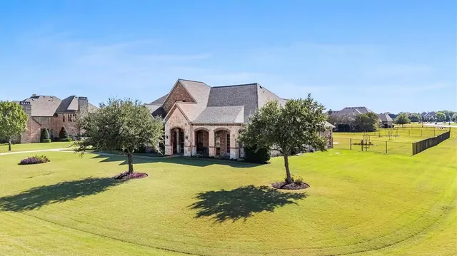 a swimming pool with trees in front of it