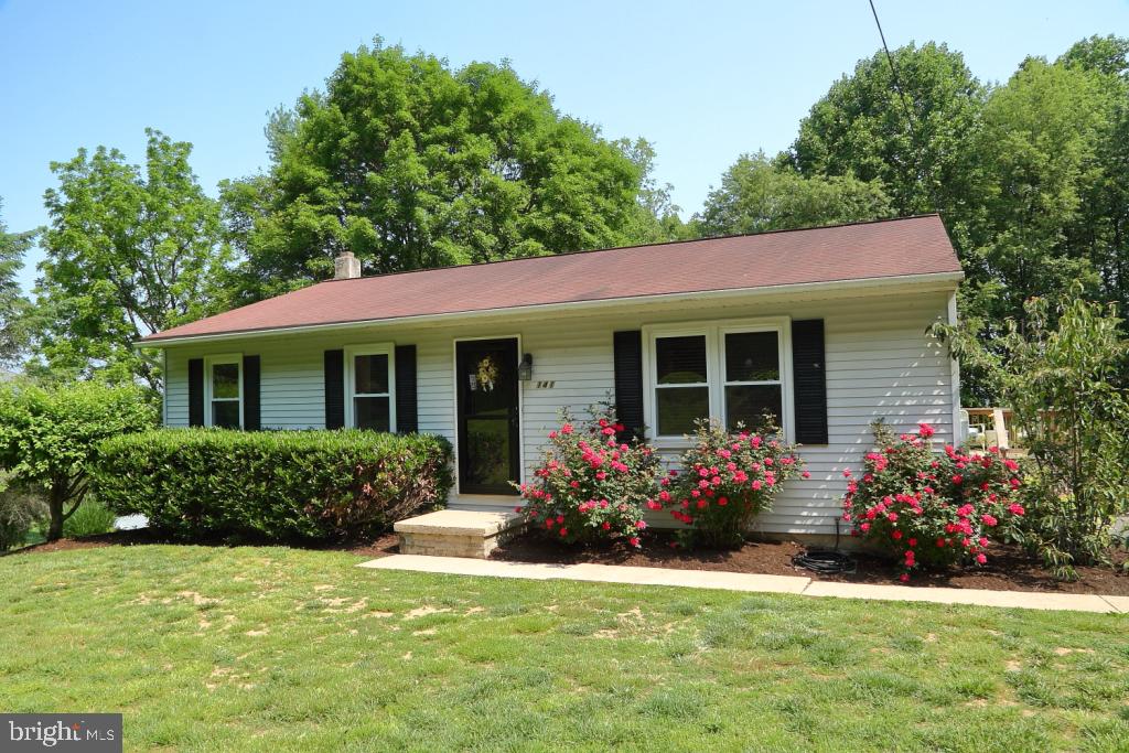 141 Frogtown Road Pequea, PA 17565 - Photo 1 of 28 a front view of house with yard and green space