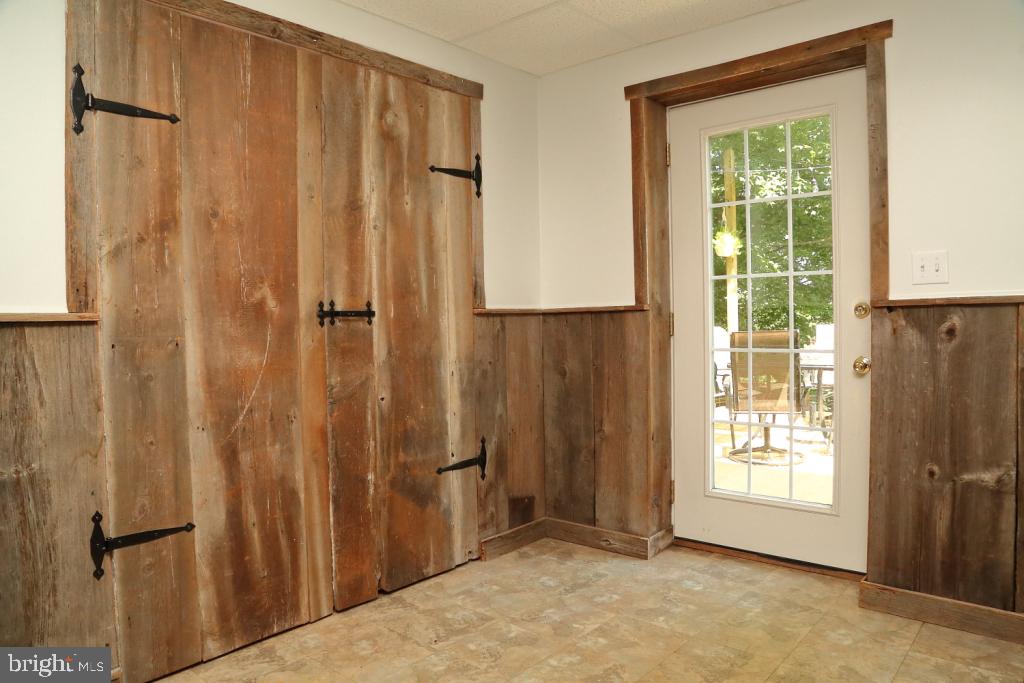 141 Frogtown Road Pequea, PA 17565 - Photo 22 of 28 a view of an empty room with wooden floor and a window