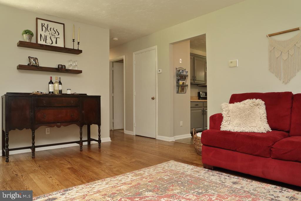 141 Frogtown Road Pequea, PA 17565 - Photo 4 of 28 a living room with furniture and painting on the wall