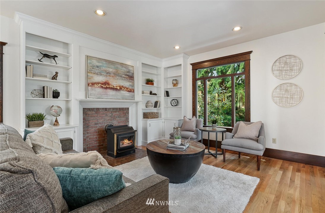 5124 1st Avenue Northwest Seattle, WA 98103 - Photo 14 of 35 a living room with furniture and a fireplace