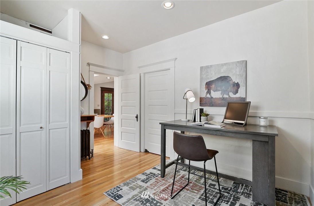 5124 1st Avenue Northwest Seattle, WA 98103 - Photo 16 of 35 a view of a workspace with furniture and wooden floor