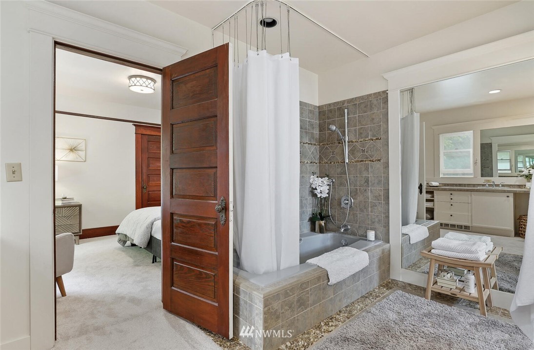 5124 1st Avenue Northwest Seattle, WA 98103 - Photo 18 of 35 a bathroom with a tub shower sink and toilet