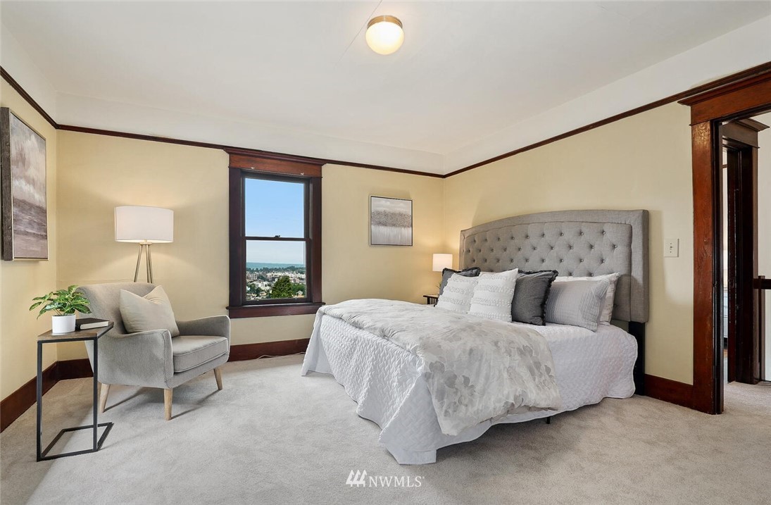 5124 1st Avenue Northwest Seattle, WA 98103 - Photo 20 of 35 a bedroom with a bed and window