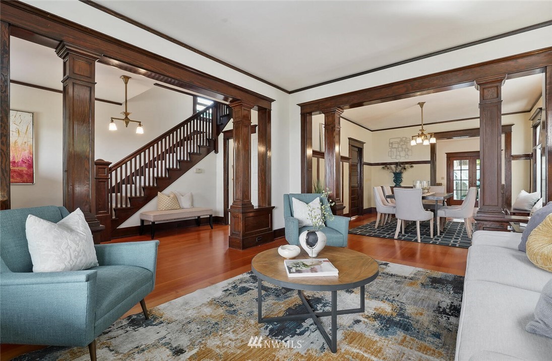 5124 1st Avenue Northwest Seattle, WA 98103 - Photo 3 of 35 a living room with furniture and a dining table with wooden floor