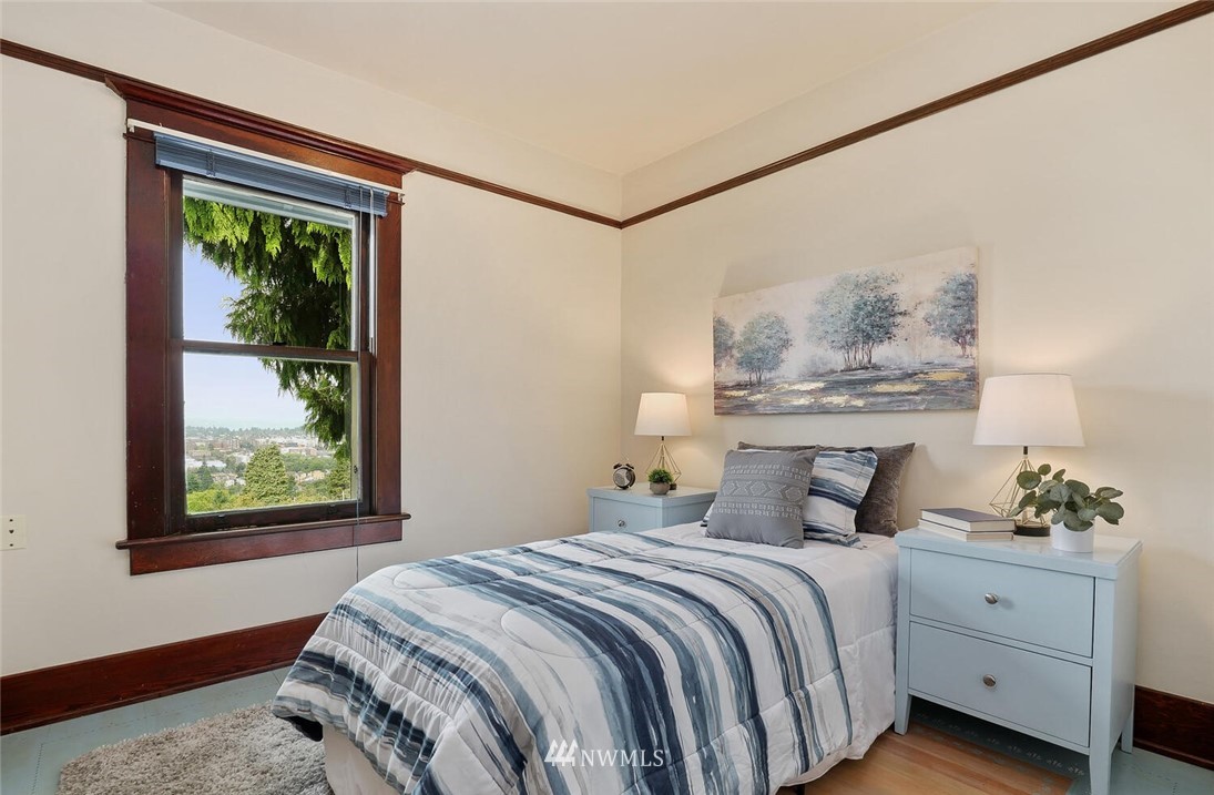 5124 1st Avenue Northwest Seattle, WA 98103 - Photo 21 of 35 a bedroom with a large bed and a window