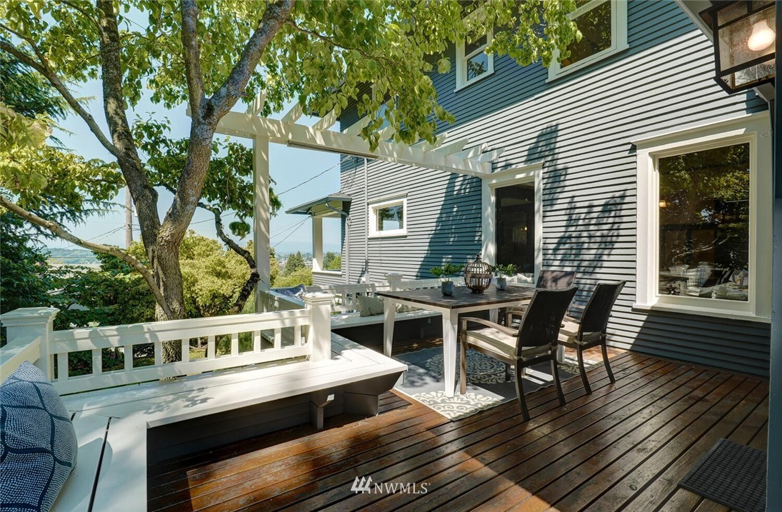 5124 1st Avenue Northwest Seattle, WA 98103 - Photo 26 of 35 a view of a house with chairs and wooden bench