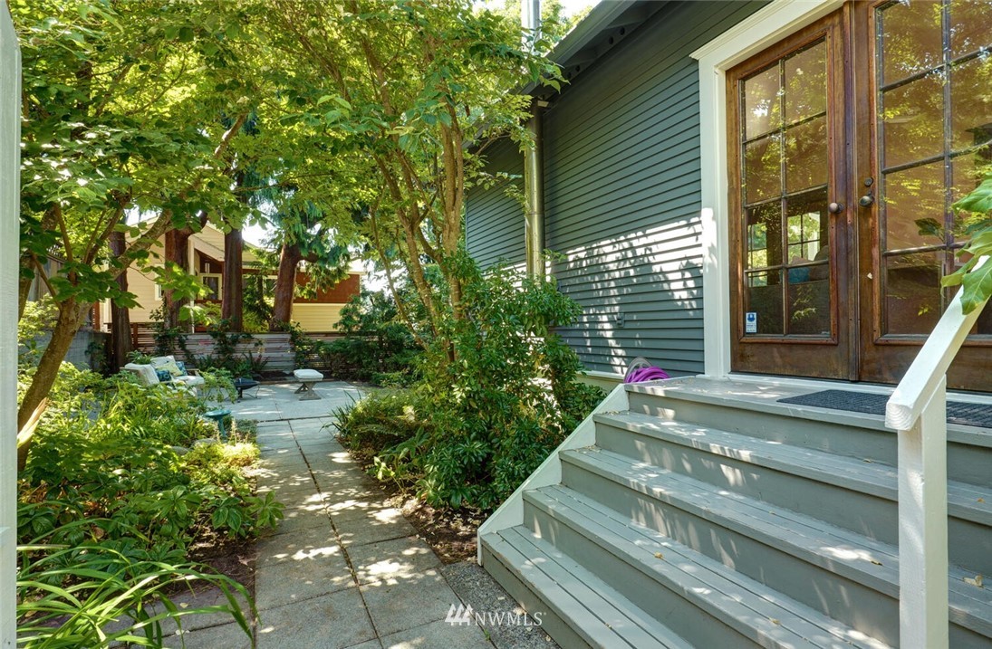 5124 1st Avenue Northwest Seattle, WA 98103 - Photo 29 of 35 a front view of a house with a yard