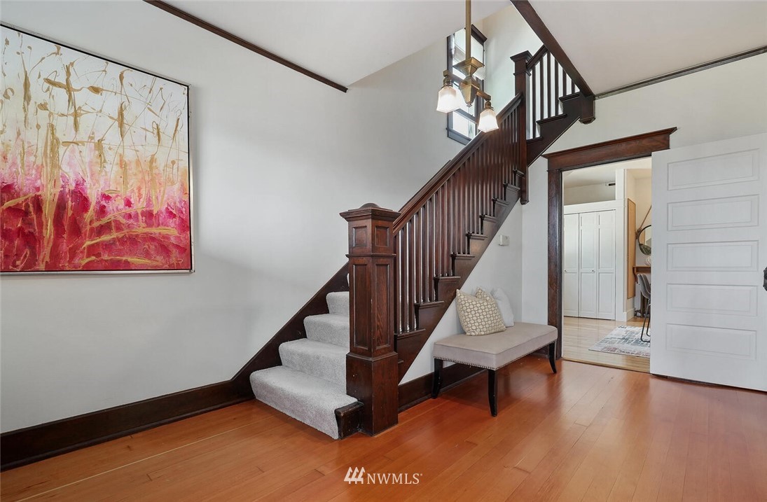 5124 1st Avenue Northwest Seattle, WA 98103 - Photo 4 of 35 a view of entryway with stairs and wooden floor