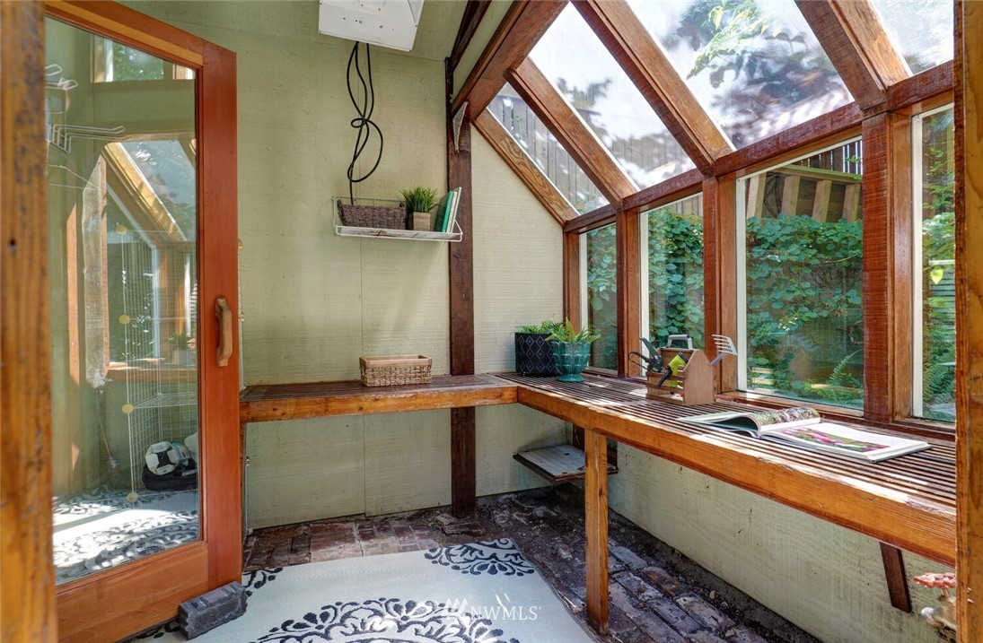 5124 1st Avenue Northwest Seattle, WA 98103 - Photo 31 of 35 a room with wooden floor table and glass door